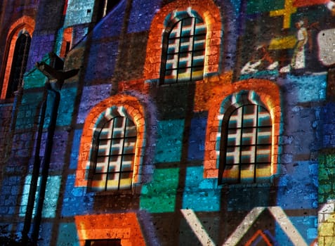 Detail of a wall of an old building in Chartres (Eure&Loir in France) during the yearly summer illumination nights.