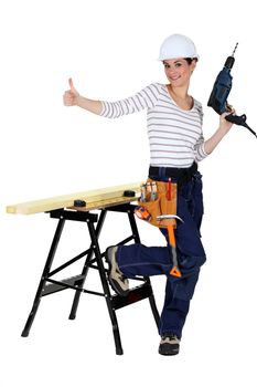 happy-looking female carpenter thumb up