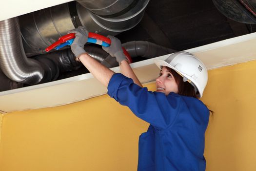 Female plumber at work.