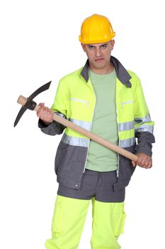 A man holding a pickaxe with a serial killer face.