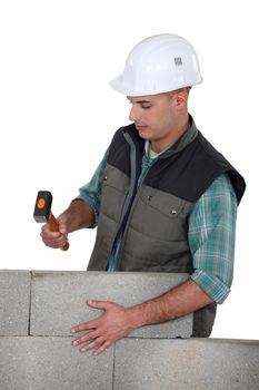 Stonemason holding a mallet