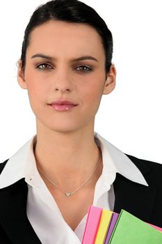 Professional brunette holding office files