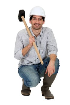 Tradesman holding a mallet