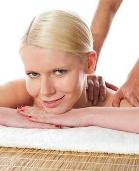 Young woman having massage procedure isolated over white background