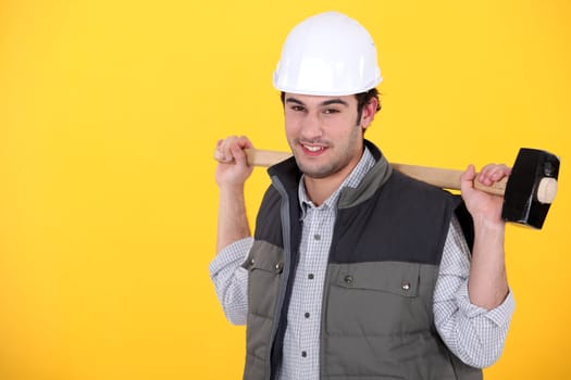 Tradesman carrying a mallet