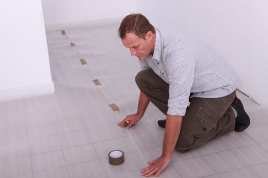 Man covering floor