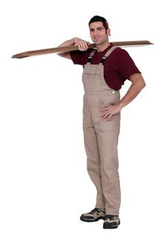 Happy woodworker standing on white background