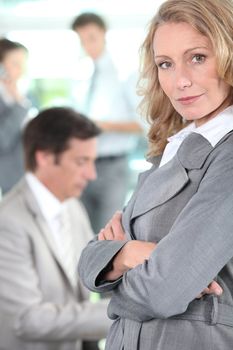 Businesswoman standing arms-crossed