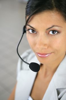 Woman wearing a telephone headset