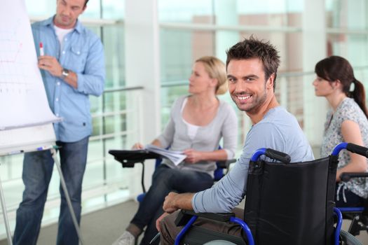 Man in wheelchair at work