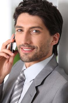 Businessman making call using mobile telephone