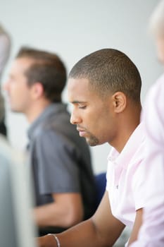 Men concentrated in front of screen