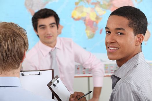 young teacher and pupils in university