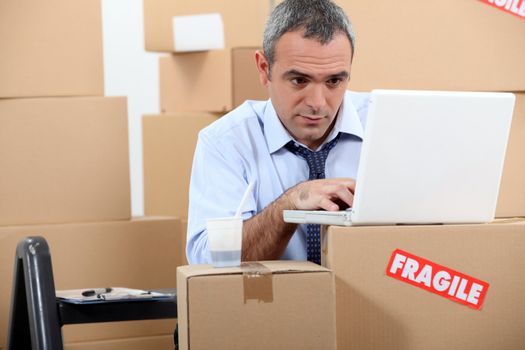 Man surrounded by boxes