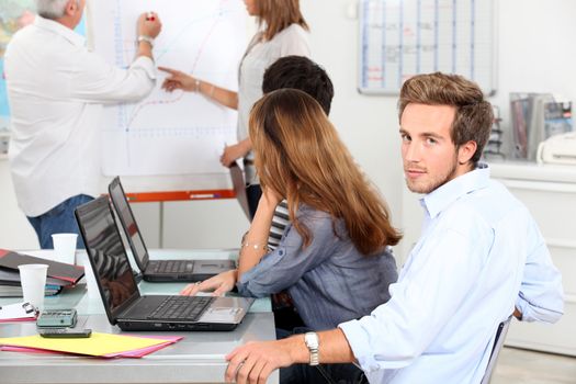 Young man in a sales briefing