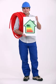 Man holding length of pipe and energy rating poster