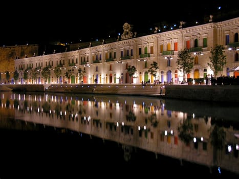 A nightshot of the waterfront in Valletta, Malta.