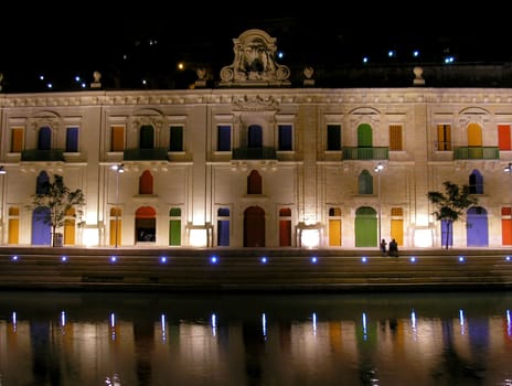 A nightshot of the waterfront in Valletta, Malta.