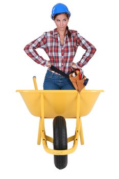 Annoyed girl in a barrow isolated on white background