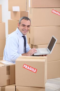 portrait of a man with cardboard boxes
