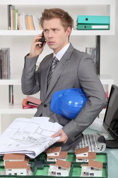 An annoyed architect talking on the phone
