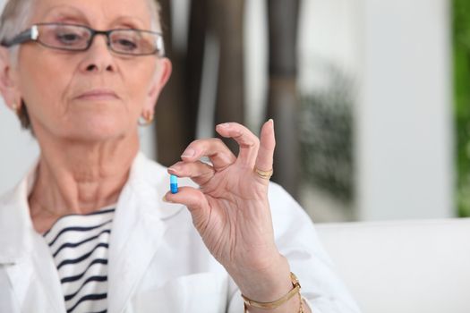 senior woman taking pills
