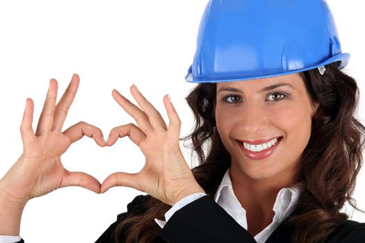 Businesswoman making heart shape