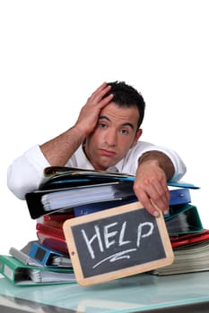 Office worker with a sign asking for help
