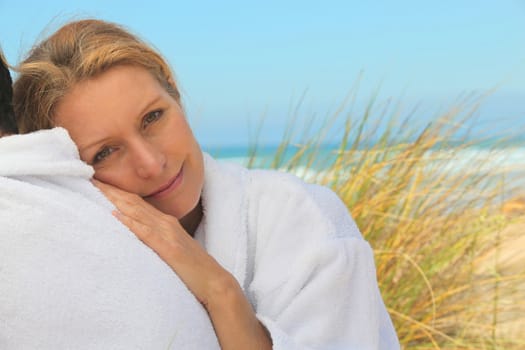 Woman relaxing by the seaside
