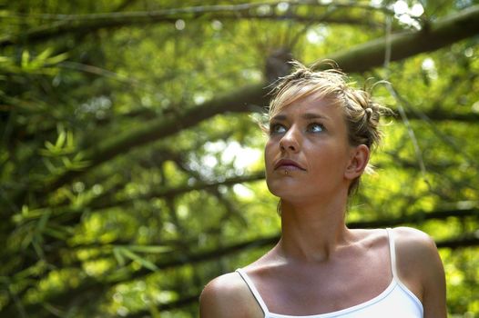Woman stood amongst branches