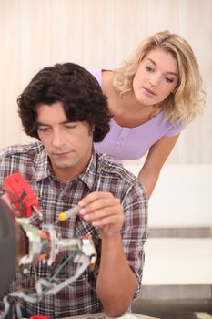 Technician repairing a TV