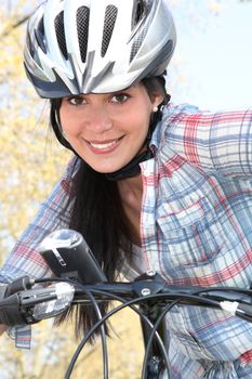 girl on bike with safety helmet