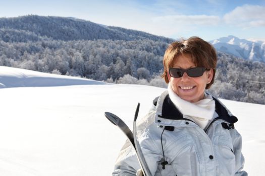 Mature female skier on a mountain