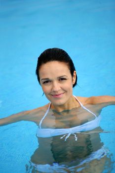 Brunette in swimming pool