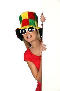 Woman wearing a comical hat and sunglasses
