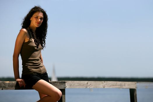 Brunette stood on boardwalk