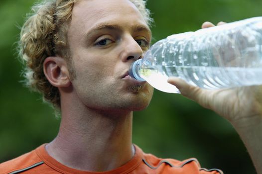 Man hydrating after outdoor run