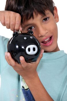 Boy with piggy bank
