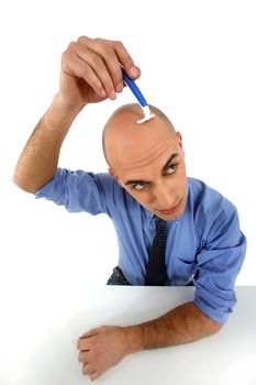 man shaving his head