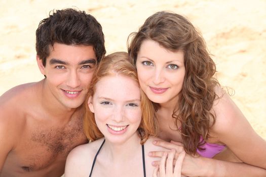 Three friends together at the seaside