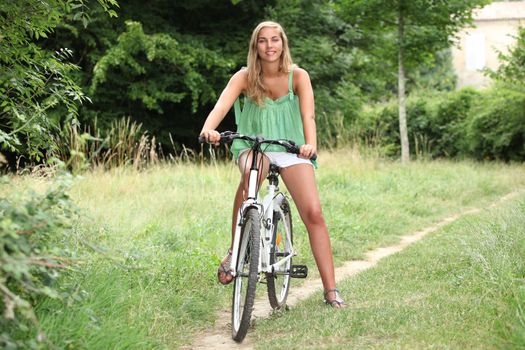 Blond teenage girl on bike ride