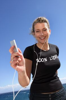 Woman listening to music outdoors
