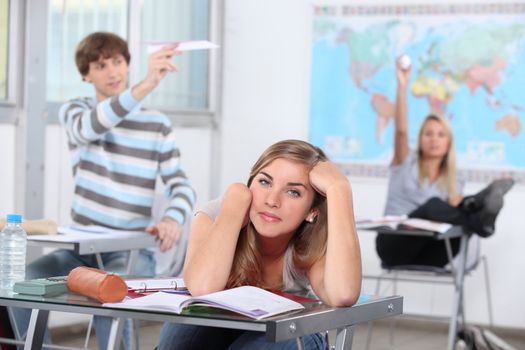 three students having break at school