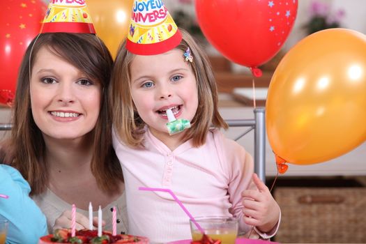 Little girl with mother at party