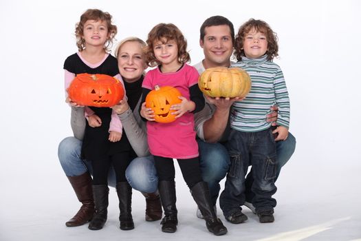 portrait of kids with pumpkins