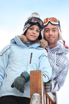 Couple enjoying skiing holiday