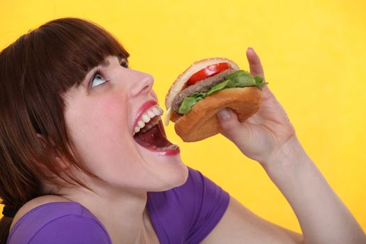 Woman eating burger