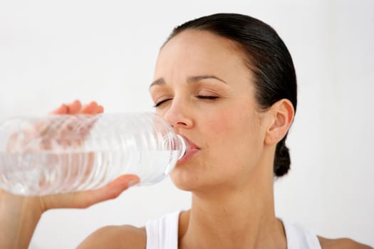 Woman drinking from a bottle of water