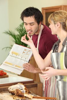 young couple cooking together