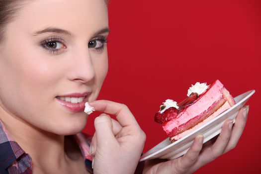Woman tempted by a piece of cake
